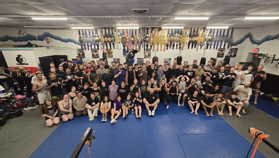 TCB Team with Championship Belts