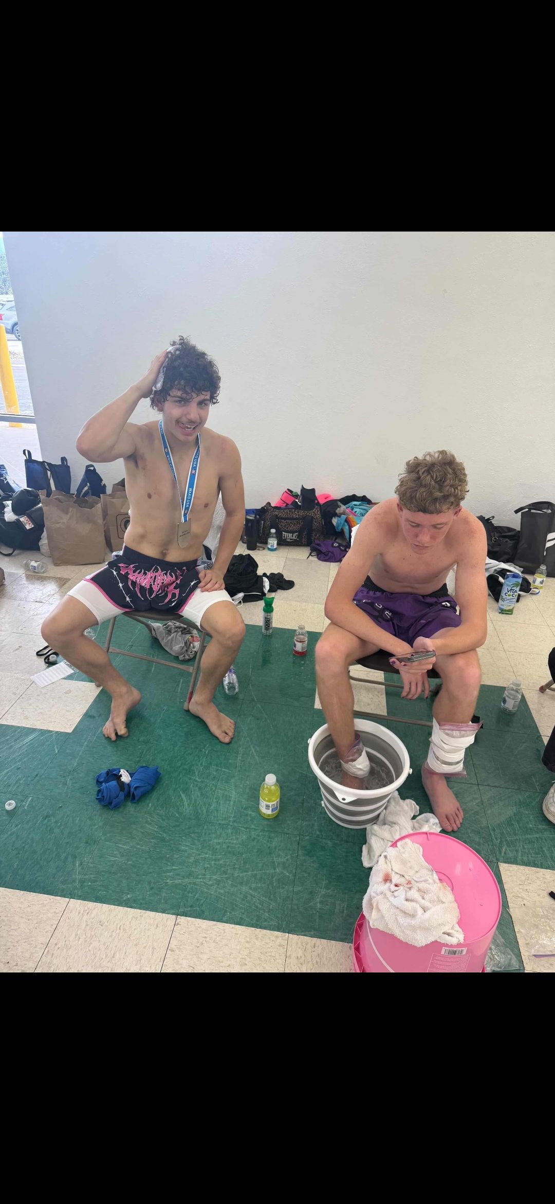 Two TCB fighters resting and icing down between bouts at the 2026 WAKO USA Nationals
