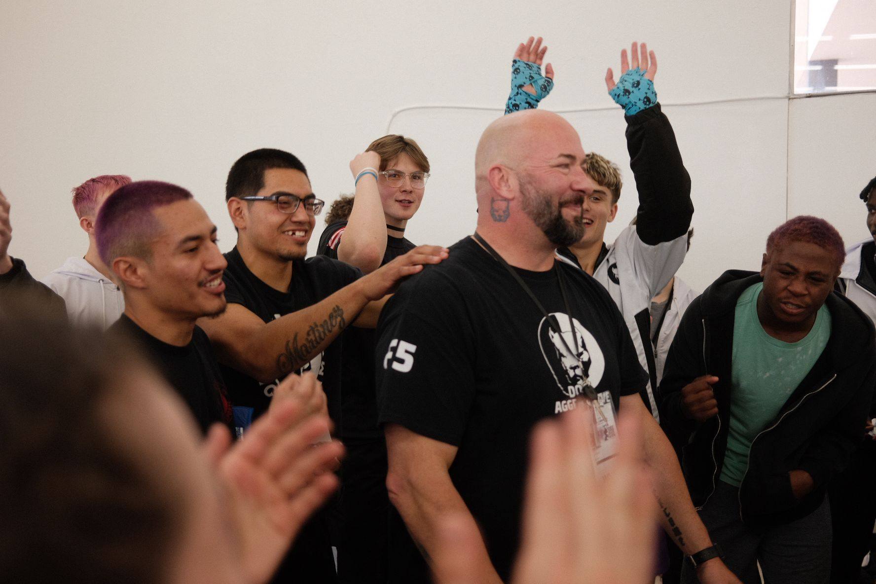 Coach Papa Pit being celebrated by the TCB team after a WAKO USA win